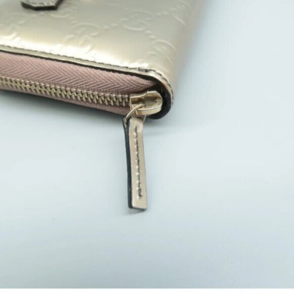 Authentic Gucci Champaigne Metallic Gold GG Tassel Zip Around Wallet - Picture 8 of 12